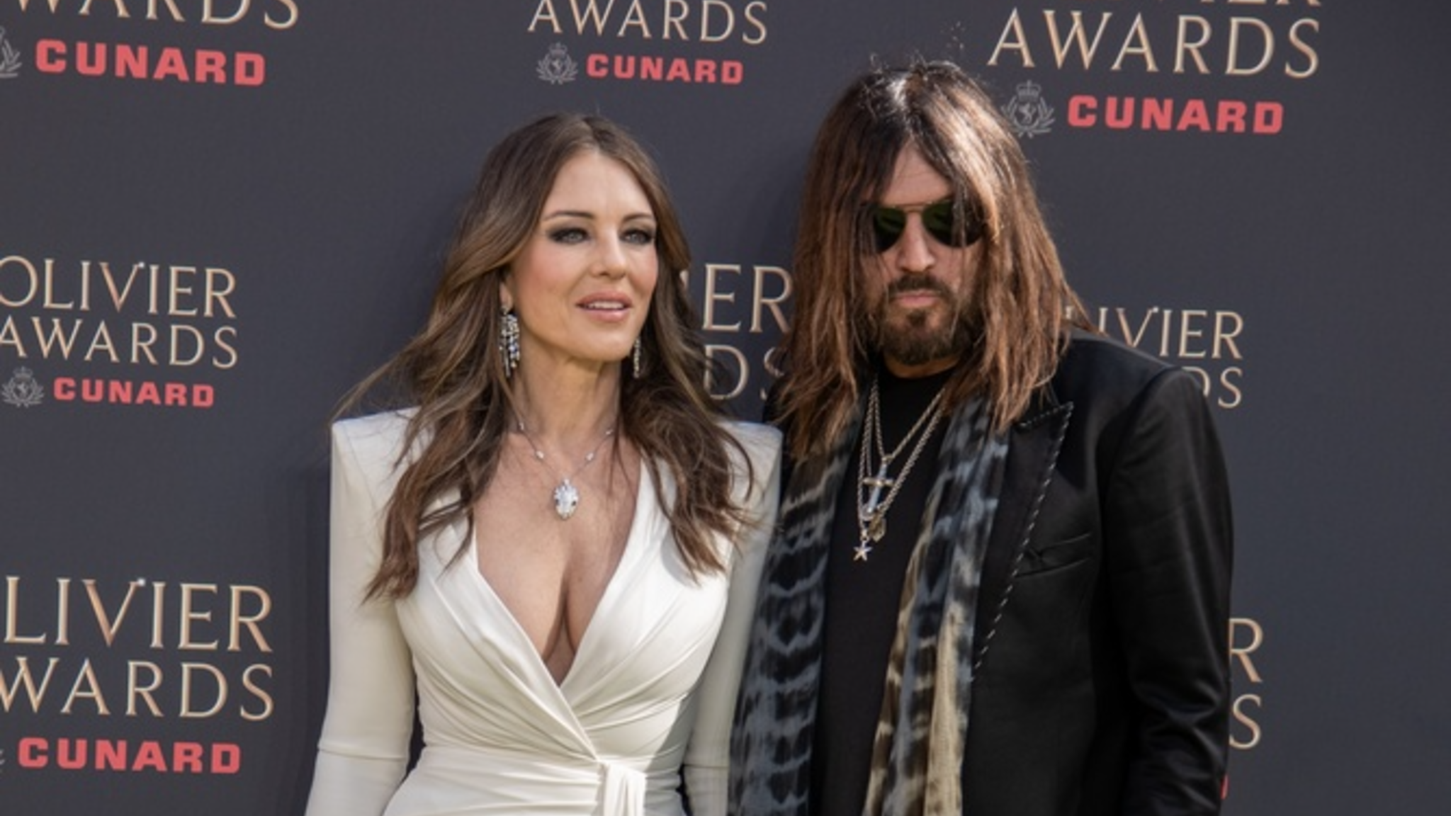 Billy Ray Cyrus’ Vacation Outfit Divides Fans During Trip With Elizabeth Hurley