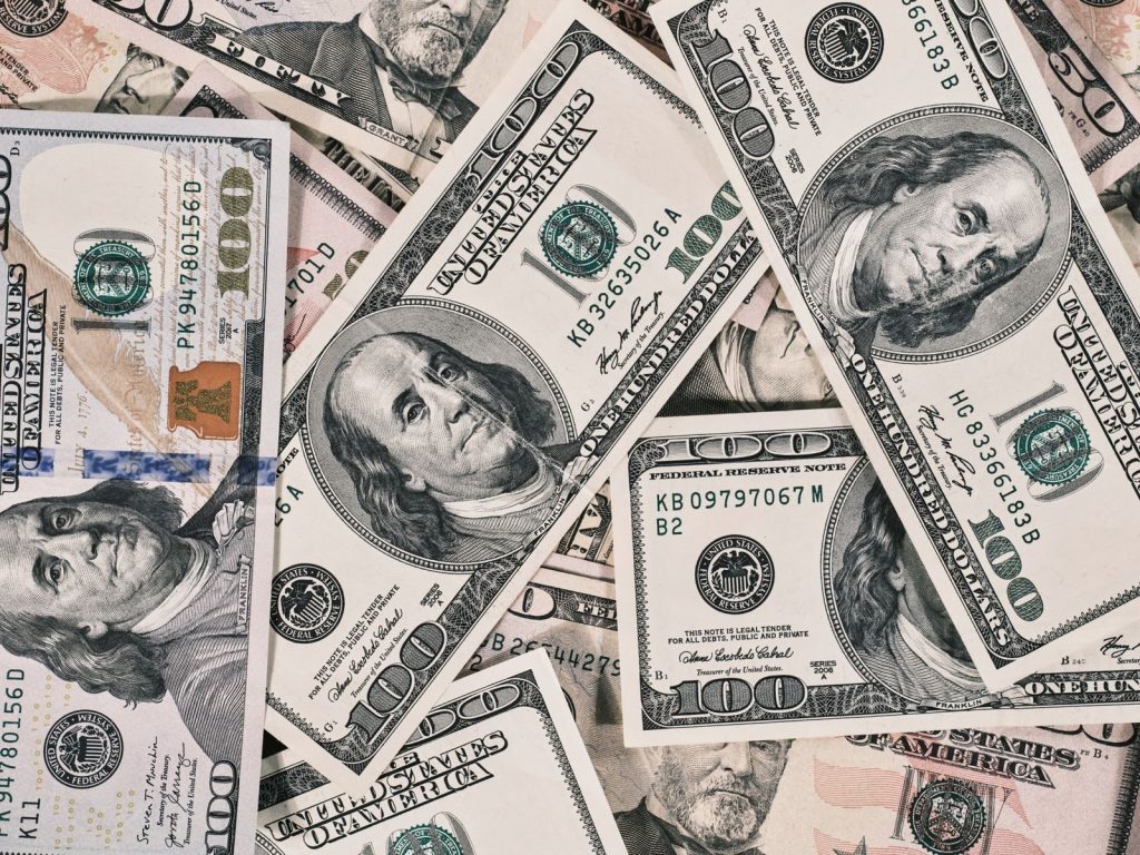 Detailed close-up of US dollar bills highlighting wealth and finance concepts.